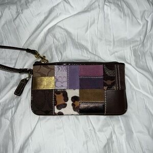 Coach patchwork wristlet — purple, brown, and gold